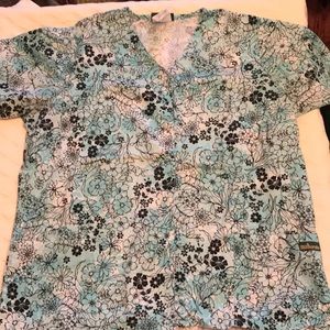 Lot of 2 scrub tops- brand is UA